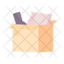 Open cardboard box with pillow and vase Icon