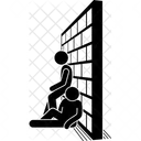 Mann sitzt in der Nähe einer Wand  Symbol